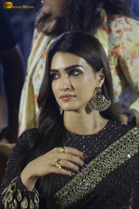 indian actress kriti sanon in a shiny black saree at a movie event