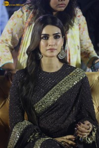 indian actress kriti sanon in a shiny black saree at a movie event