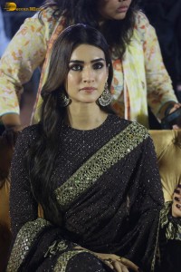 indian actress kriti sanon in a shiny black saree at a movie event