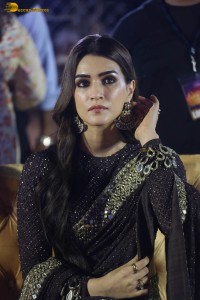 indian actress kriti sanon in a shiny black saree at a movie event