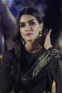 indian actress kriti sanon in a shiny black saree at a movie event