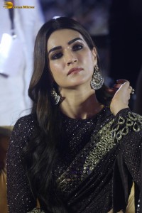 indian actress kriti sanon in a shiny black saree at a movie event