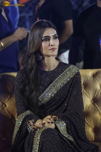 indian actress kriti sanon in a shiny black saree at a movie event