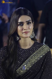 indian actress kriti sanon in a shiny black saree at a movie event