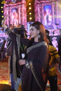 indian actress kriti sanon in a shiny black saree at a movie event