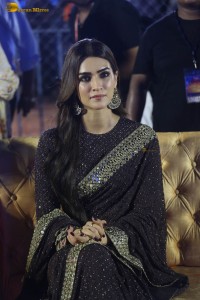indian actress kriti sanon in a shiny black saree at a movie event