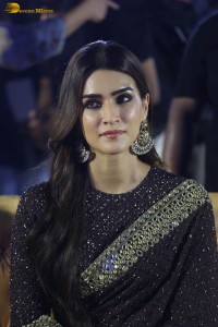 indian actress kriti sanon in a shiny black saree at a movie event