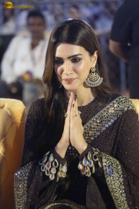 indian actress kriti sanon in a shiny black saree at a movie event