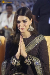 indian actress kriti sanon in a shiny black saree at a movie event