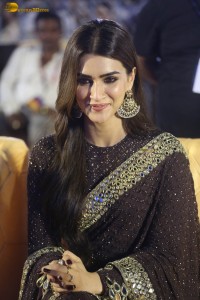 indian actress kriti sanon in a shiny black saree at a movie event