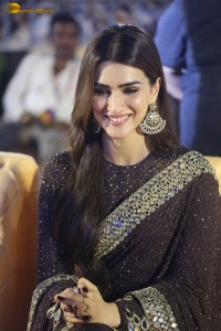 indian actress kriti sanon in a shiny black saree at a movie event