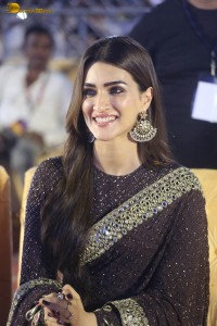 indian actress kriti sanon in a shiny black saree at a movie event