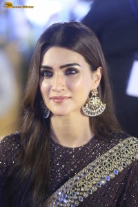 indian actress kriti sanon in a shiny black saree at a movie event