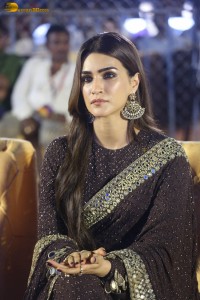 indian actress kriti sanon in a shiny black saree at a movie event