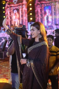 indian actress kriti sanon in a shiny black saree at a movie event