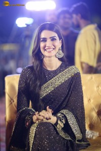 indian actress kriti sanon in a shiny black saree at a movie event
