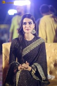 indian actress kriti sanon in a shiny black saree at a movie event