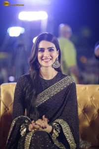 indian actress kriti sanon in a shiny black saree at a movie event