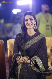 indian actress kriti sanon in a shiny black saree at a movie event