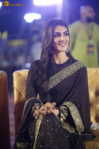 indian actress kriti sanon in a shiny black saree at a movie event