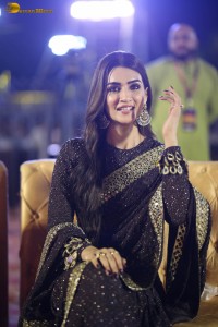 indian actress kriti sanon in a shiny black saree at a movie event