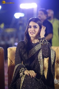 indian actress kriti sanon in a shiny black saree at a movie event