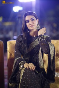 indian actress kriti sanon in a shiny black saree at a movie event