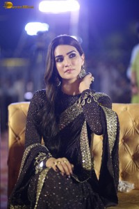 indian actress kriti sanon in a shiny black saree at a movie event