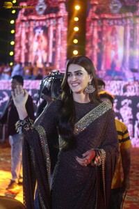 indian actress kriti sanon in a shiny black saree at a movie event