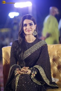 indian actress kriti sanon in a shiny black saree at a movie event