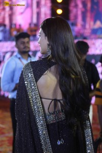 indian actress kriti sanon in a shiny black saree at a movie event