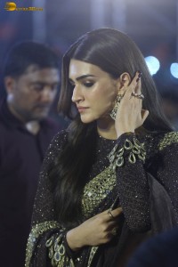 indian actress kriti sanon in a shiny black saree at a movie event