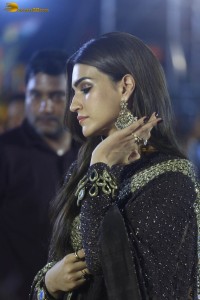 indian actress kriti sanon in a shiny black saree at a movie event