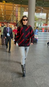 actress Kriti Sanon making a fashion statement at mumbai airport with a stylish look