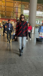 actress Kriti Sanon making a fashion statement at mumbai airport with a stylish look