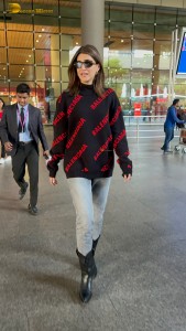 actress Kriti Sanon making a fashion statement at mumbai airport with a stylish look