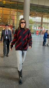 actress Kriti Sanon making a fashion statement at mumbai airport with a stylish look