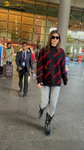 actress Kriti Sanon making a fashion statement at mumbai airport with a stylish look
