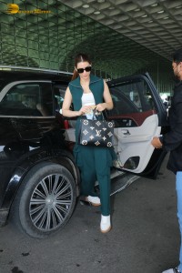 Indian Actress Kriti Sanon in a green dress at airport