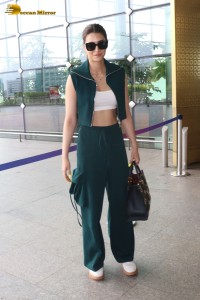 Indian Actress Kriti Sanon in a green dress at airport