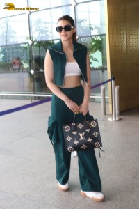 Indian Actress Kriti Sanon in a green dress at airport