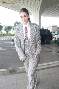 bollywood actress kriti sanon making a fashion statement in a suit at airport