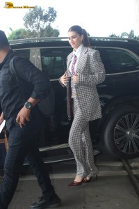 bollywood actress kriti sanon making a fashion statement in a suit at airport