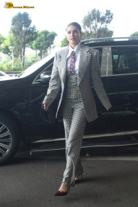 bollywood actress kriti sanon making a fashion statement in a suit at airport