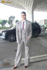 bollywood actress kriti sanon making a fashion statement in a suit at airport