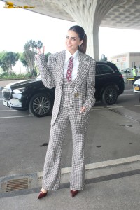 bollywood actress kriti sanon making a fashion statement in a suit at airport