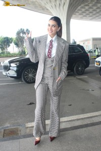 bollywood actress kriti sanon making a fashion statement in a suit at airport