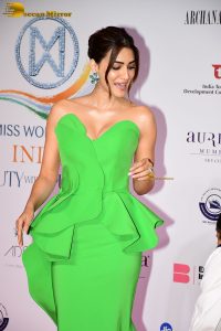 bollywood actress kriti sanon in a shoulderless green dress on red carpet