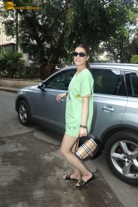 bollywood actress kriti sanon in green t-shirt and shorts