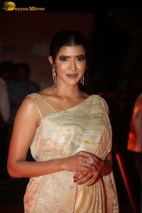 mohan babu daughter and actress lakshmi manchu in a gold color saree